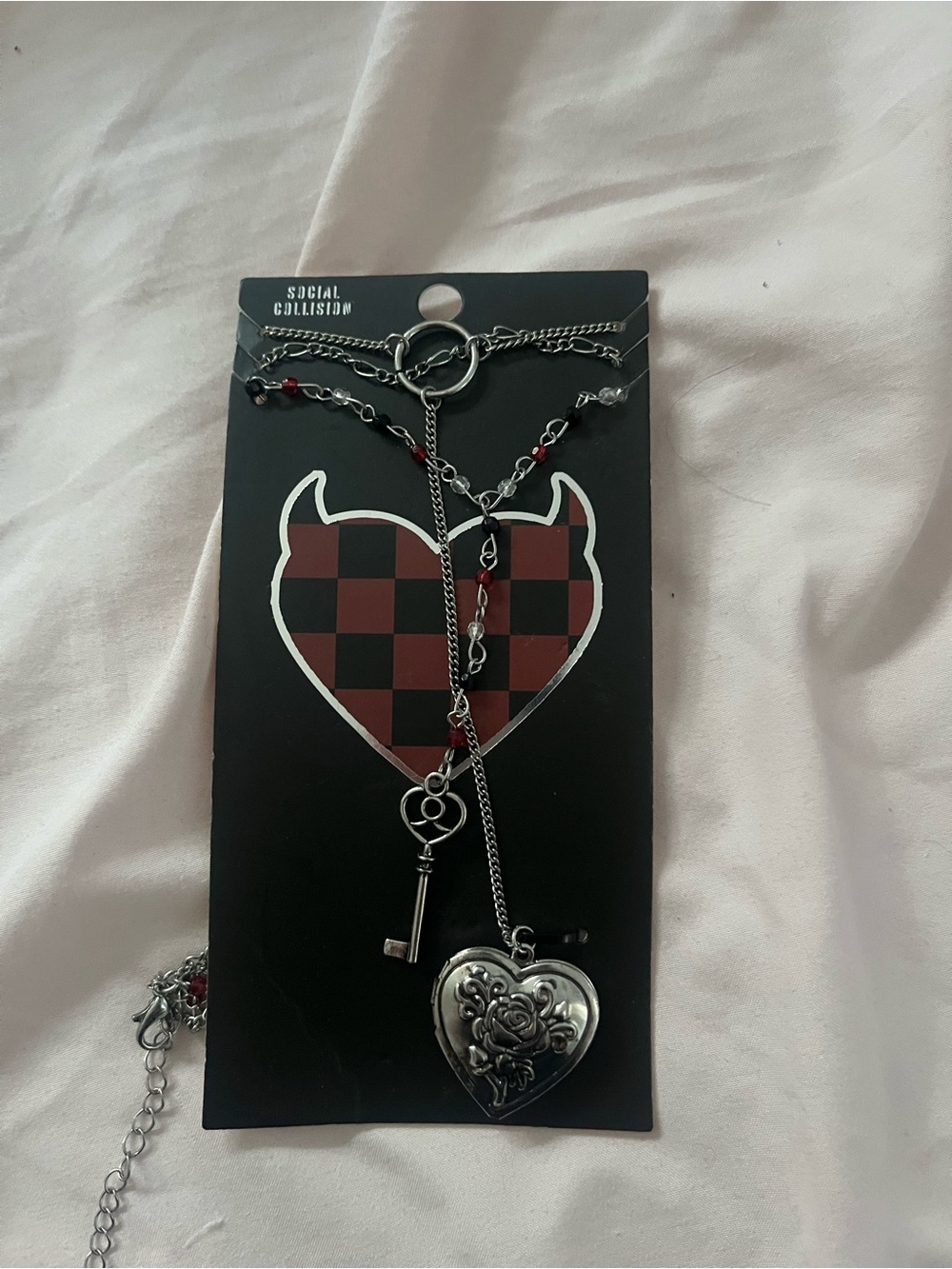 Social Collision Silver Heart Locket & Key Necklace with Red Accents